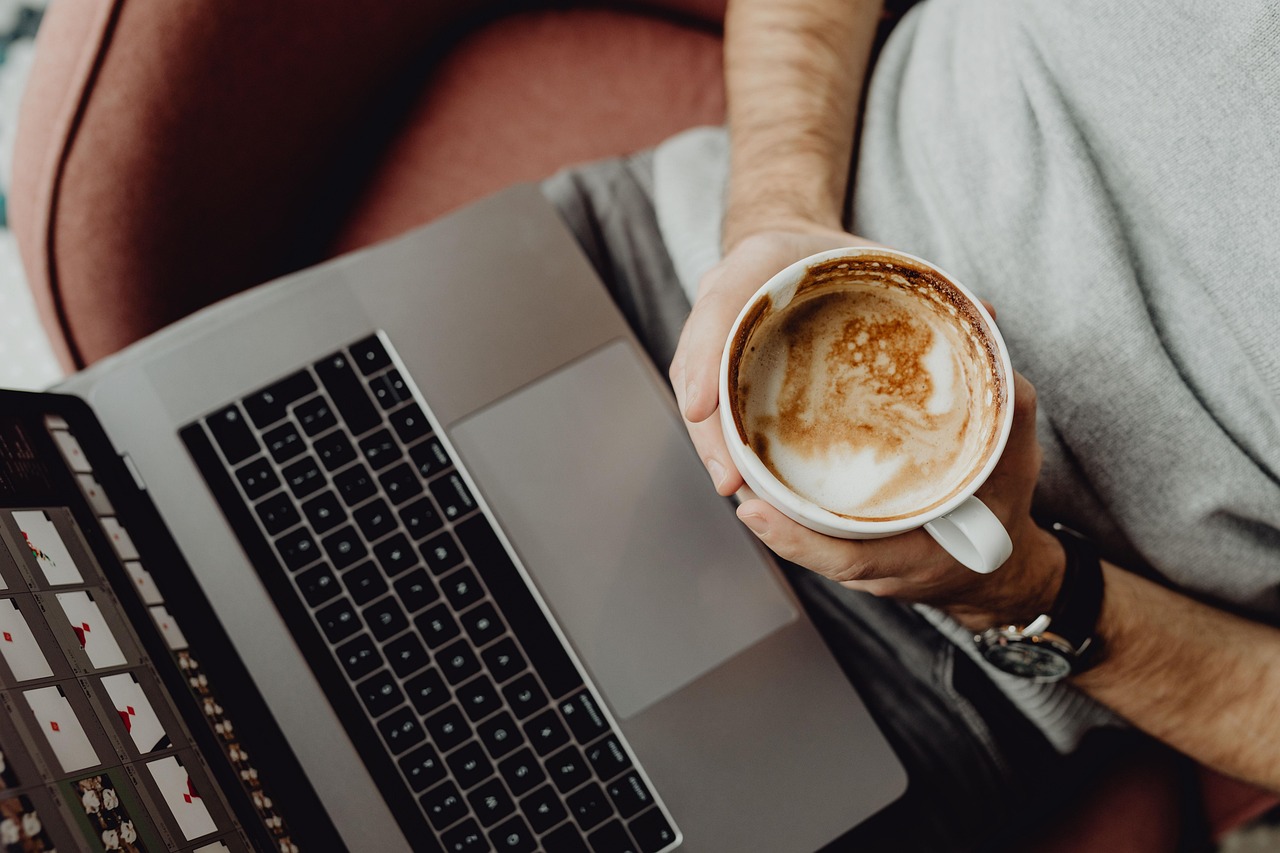 Coffee, cup, computer — Punching Up Engagement: How Boxing Streams Drive Viewer Interaction in Sports Streaming